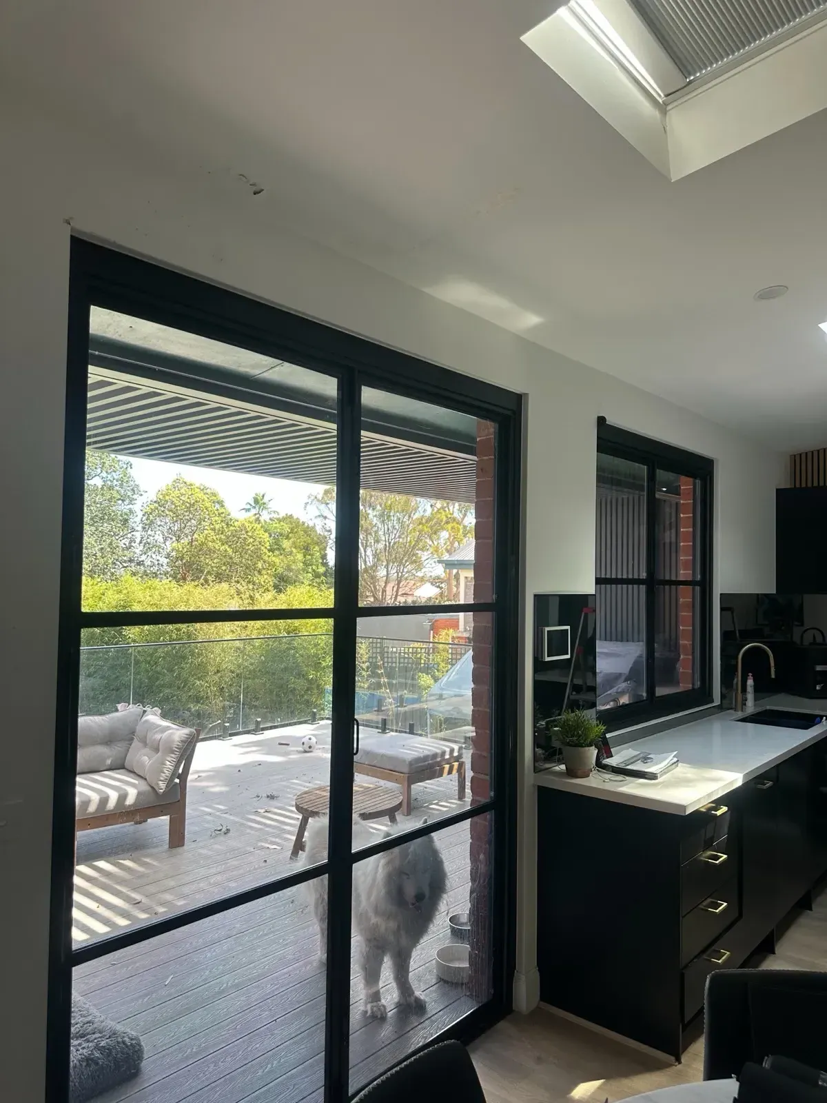 Kitchen with roller blinds on sliding door