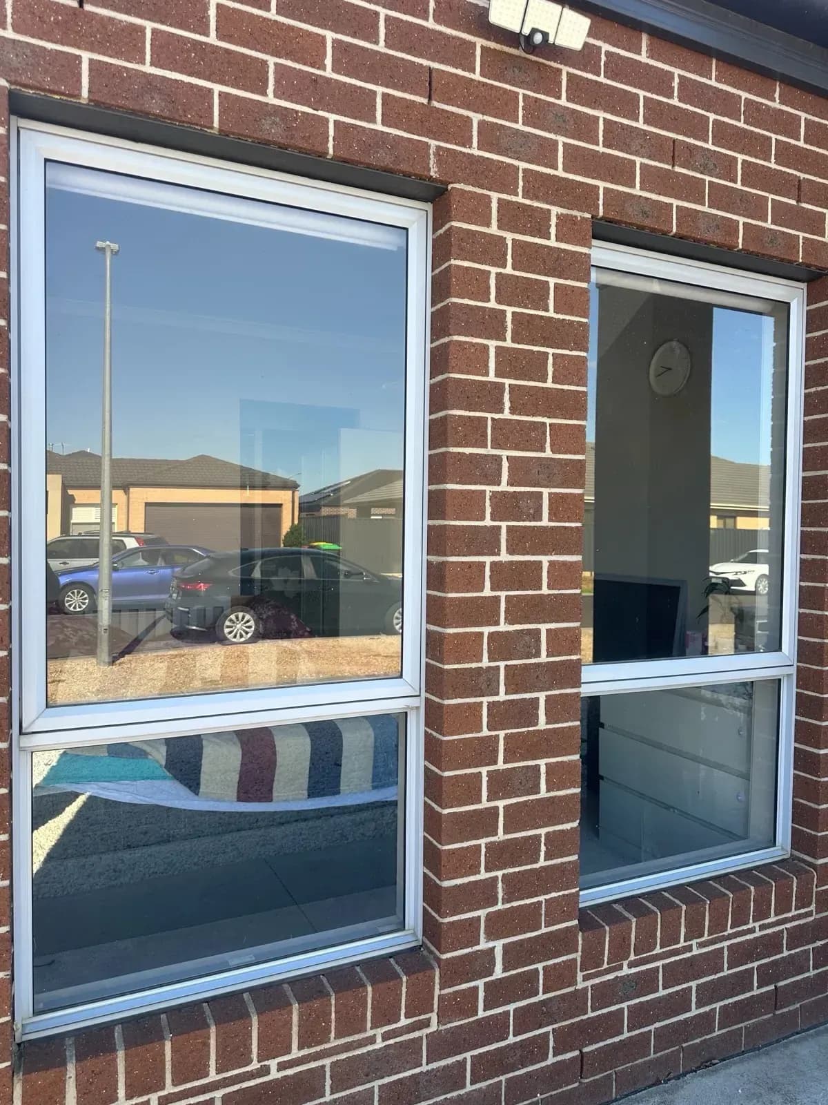 Tinted windows on a Melbourne brick home